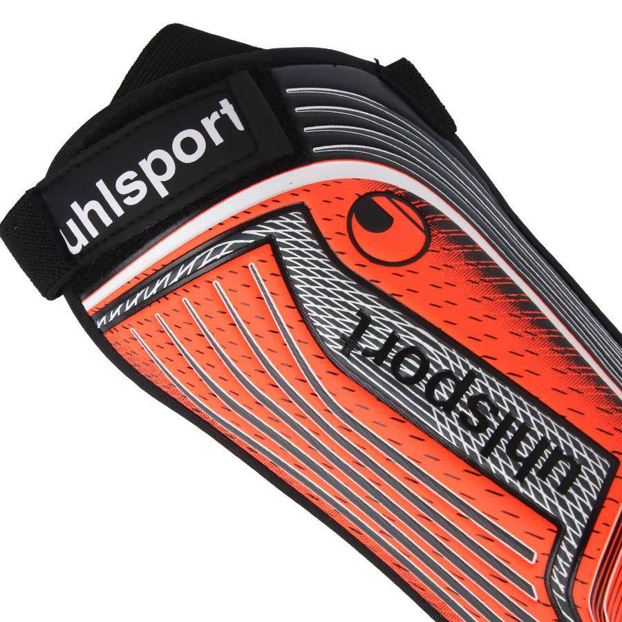 Czarno pomarańczowe ochraniacze piłkarskie Uhlsport Tibia Plate Pro